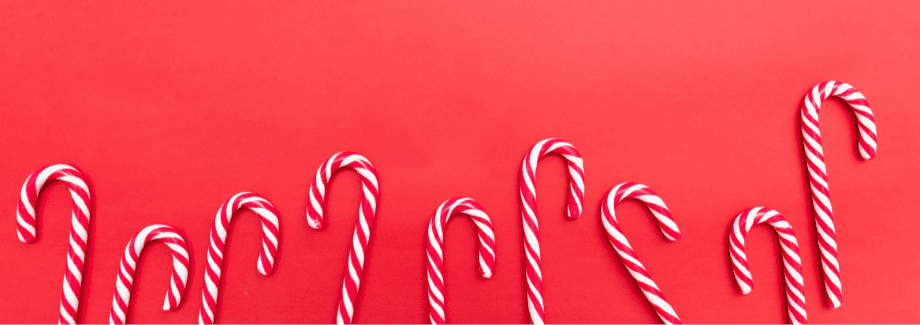rot-weiße zuckerstangen vor rotem hintergrund weihnachtsmail vorlagen
